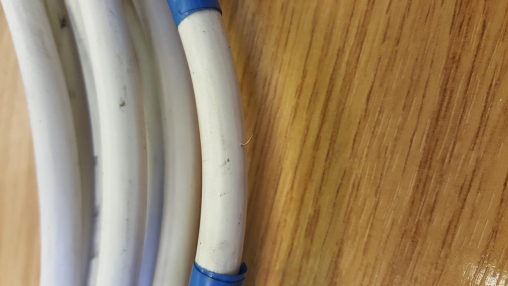 Photo of Triveneta cable with single strand protruding from sheath ACI finds more unsafe cable for sale in the UK